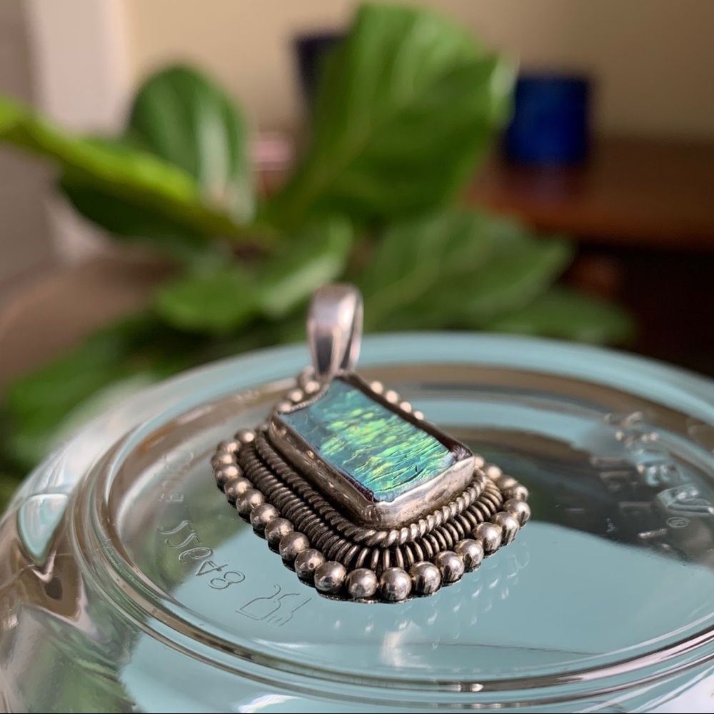 Handmade silver pendant with green foil inlay